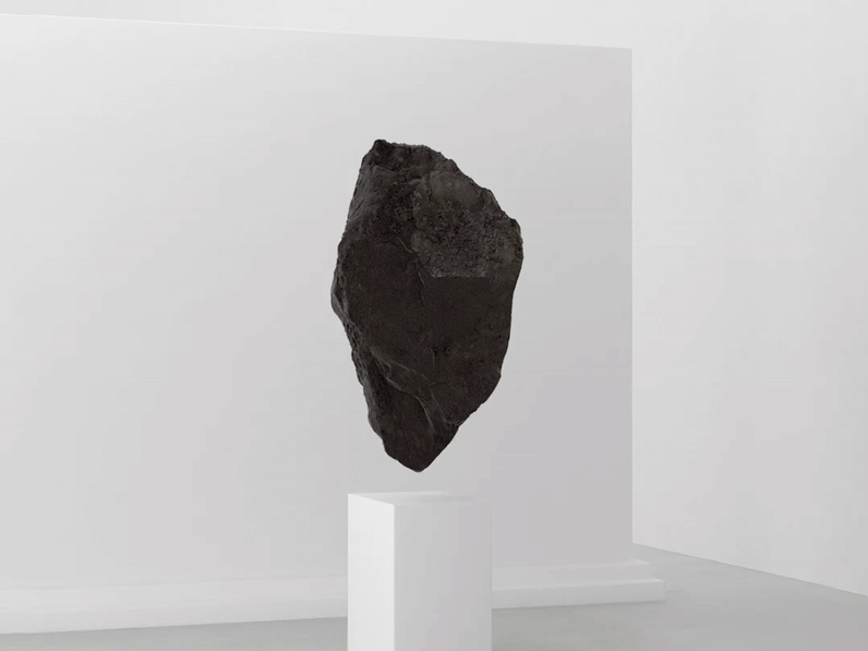 This is a sci-fi rock floating in what looks like a gallery